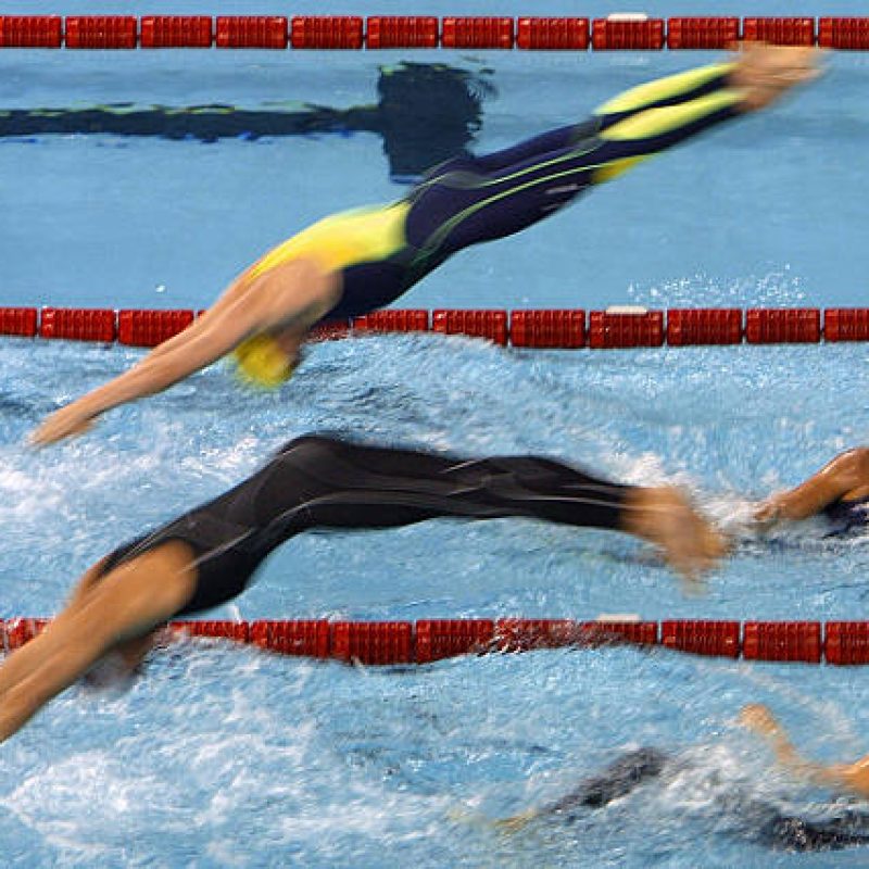 Canadian (bottom) and Australian swimmers are pictured during a men's 4X200m freestyle heat, 23 July 2003 in Barcelona, at the 10th FINA Swimming World Championships. In Australian team are Antony Matkovich, Nicholas Sprenger, Jason Cram and Craig Stevens, in Canadian team are Brian Johns, Richard Say, Mark Johnston and Brent Hayden. AFP PHOTO CHRISTOPHE SIMON  (Photo credit should read CHRISTOPHE SIMON/AFP via Getty Images)